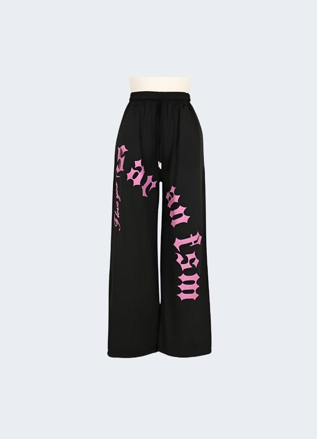 Stylish black cargo pants with contrasting pink pockets and trim, available for purchase in the UK.