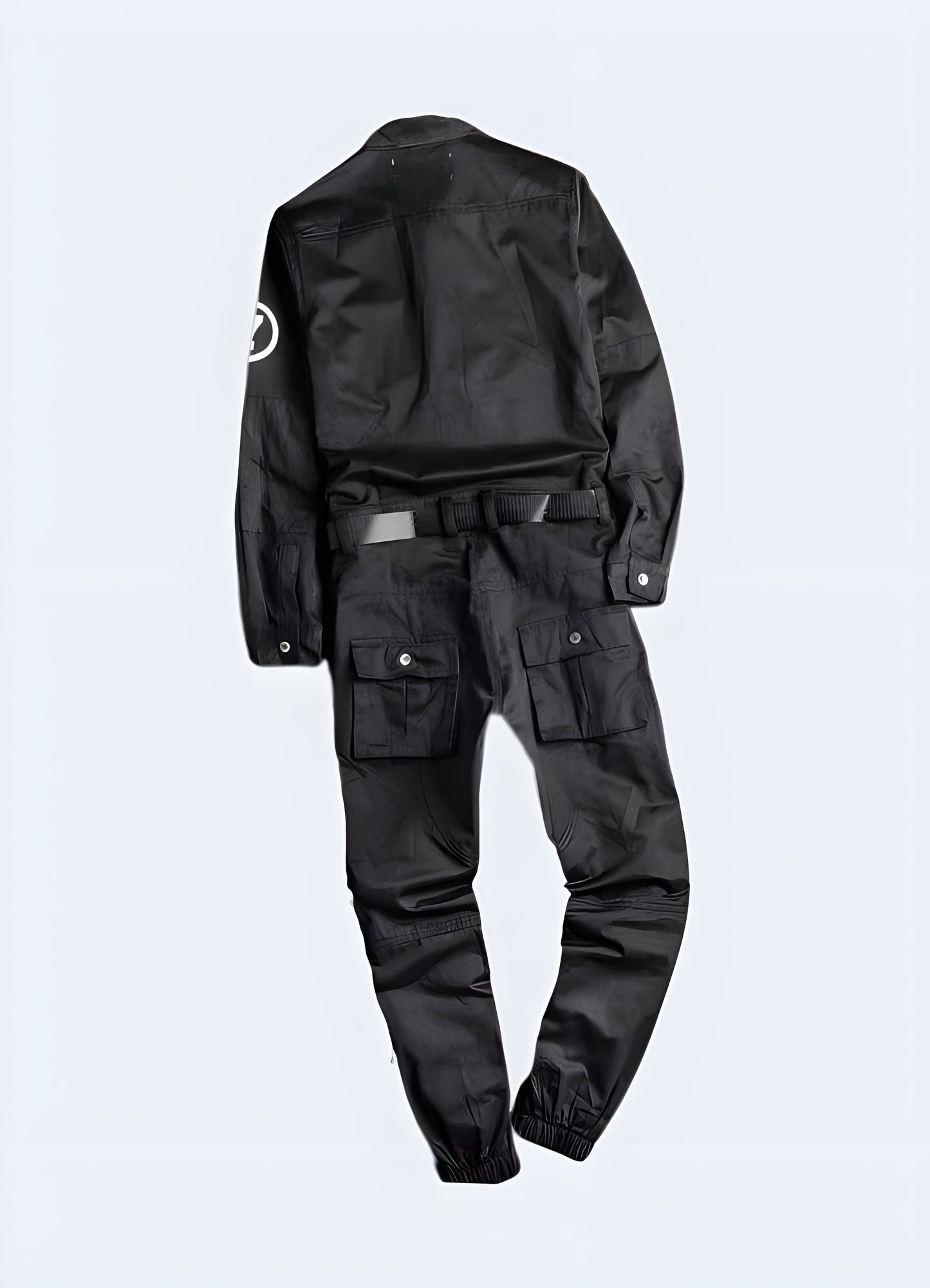 Back view of a man wearing black cargo overalls, showcasing the garment's practical design and numerous pockets, ideal for utility and style in UK settings.