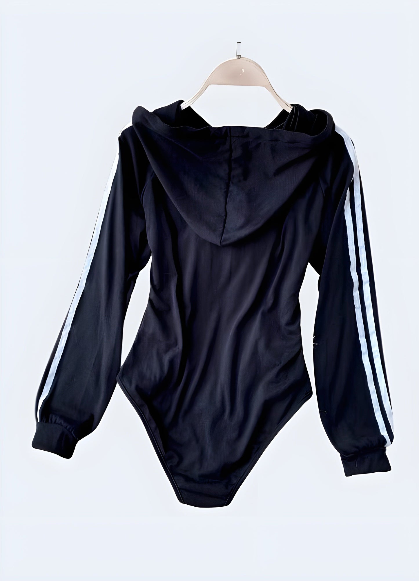 Sleek black hoodie bodysuit with a modern design, perfect for UK fashion enthusiasts seeking comfortable and stylish urban wear.