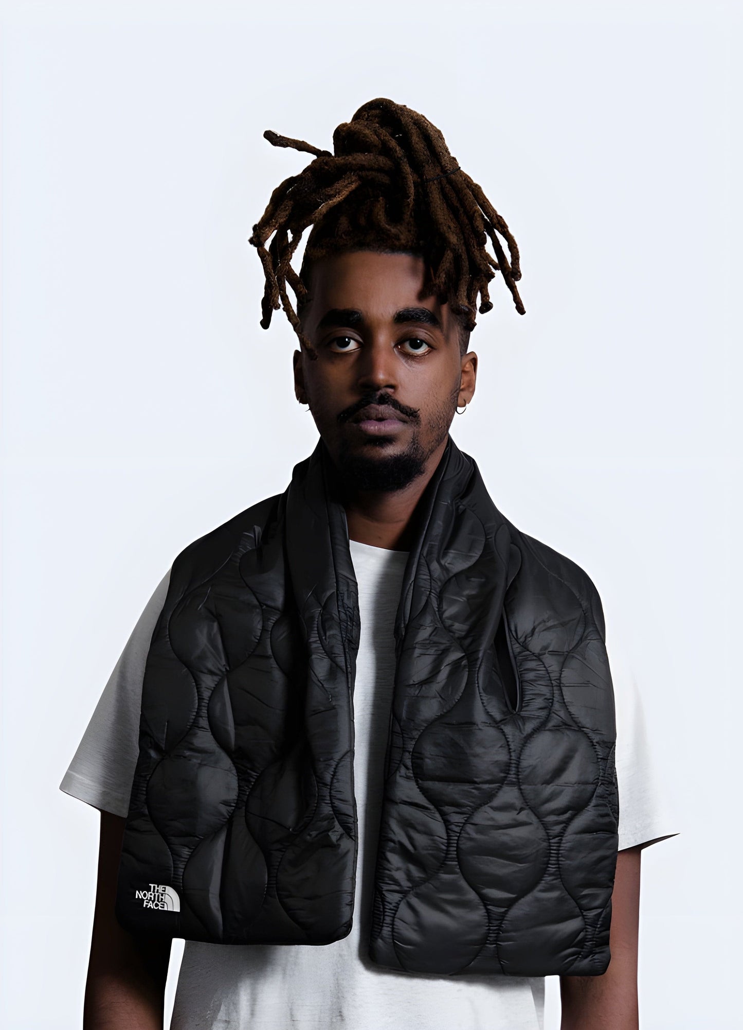 The scarf features a high-performance, insulated fabric with a minimalist, urban aesthetic.