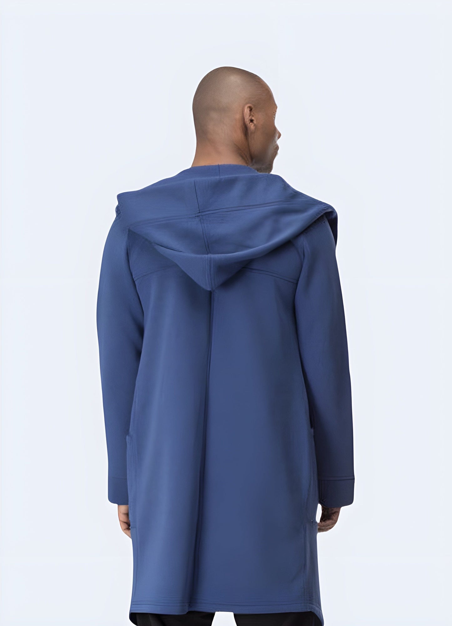 Back view of a man wearing a cyberpunk cloak, showcasing its unique silhouette and high-quality construction for a cutting-edge look in the UK.
