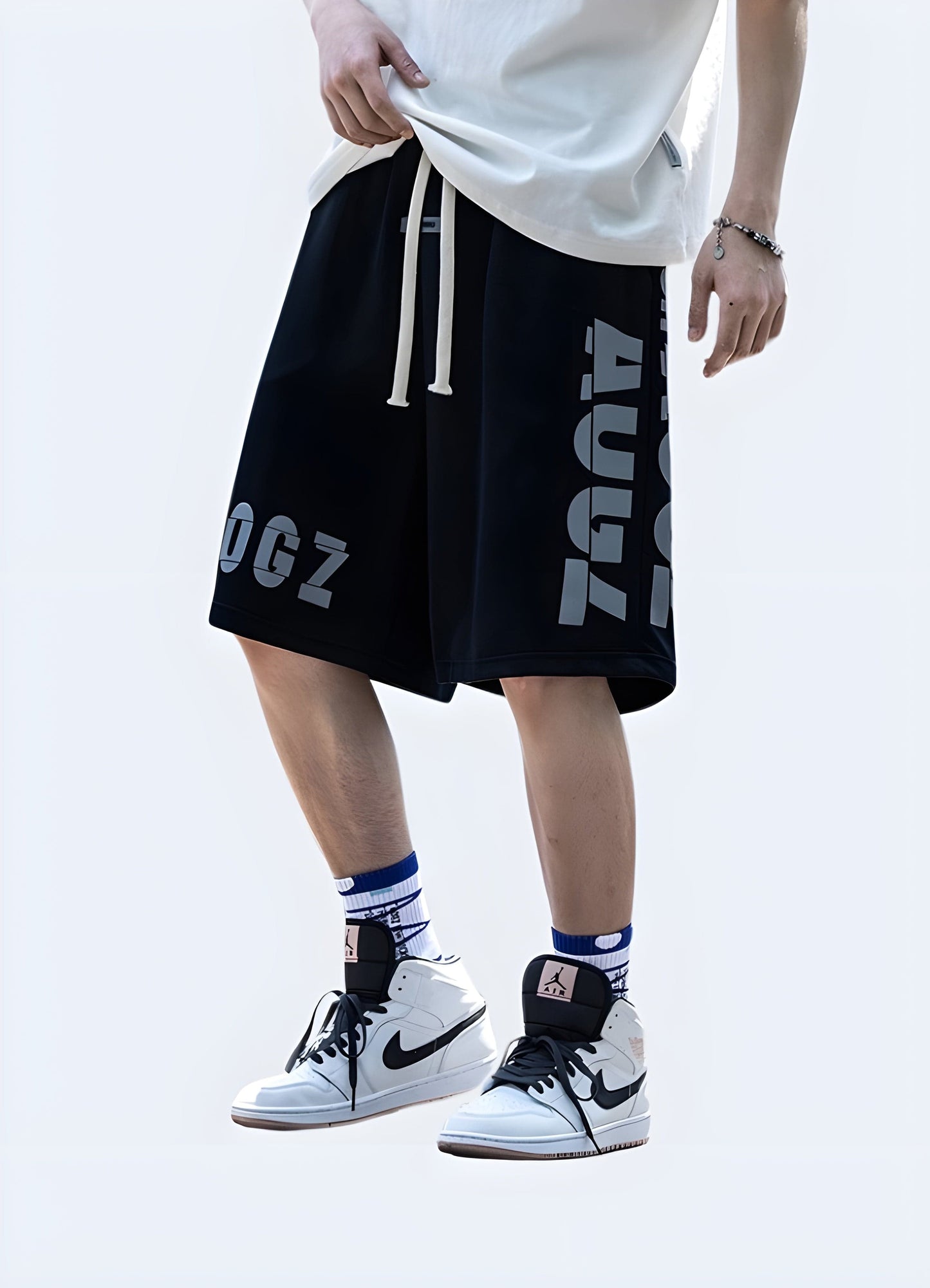 Man wearing trendy hip-hop techwear shorts, front view, showcasing the perfect blend of style and comfort for UK streetwear.