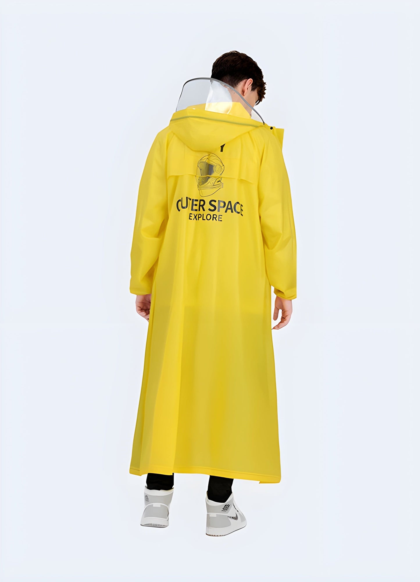 Back view of a man wearing a technical poncho, showcasing the adjustable fit and versatile style, perfect for the UK urban explorer.