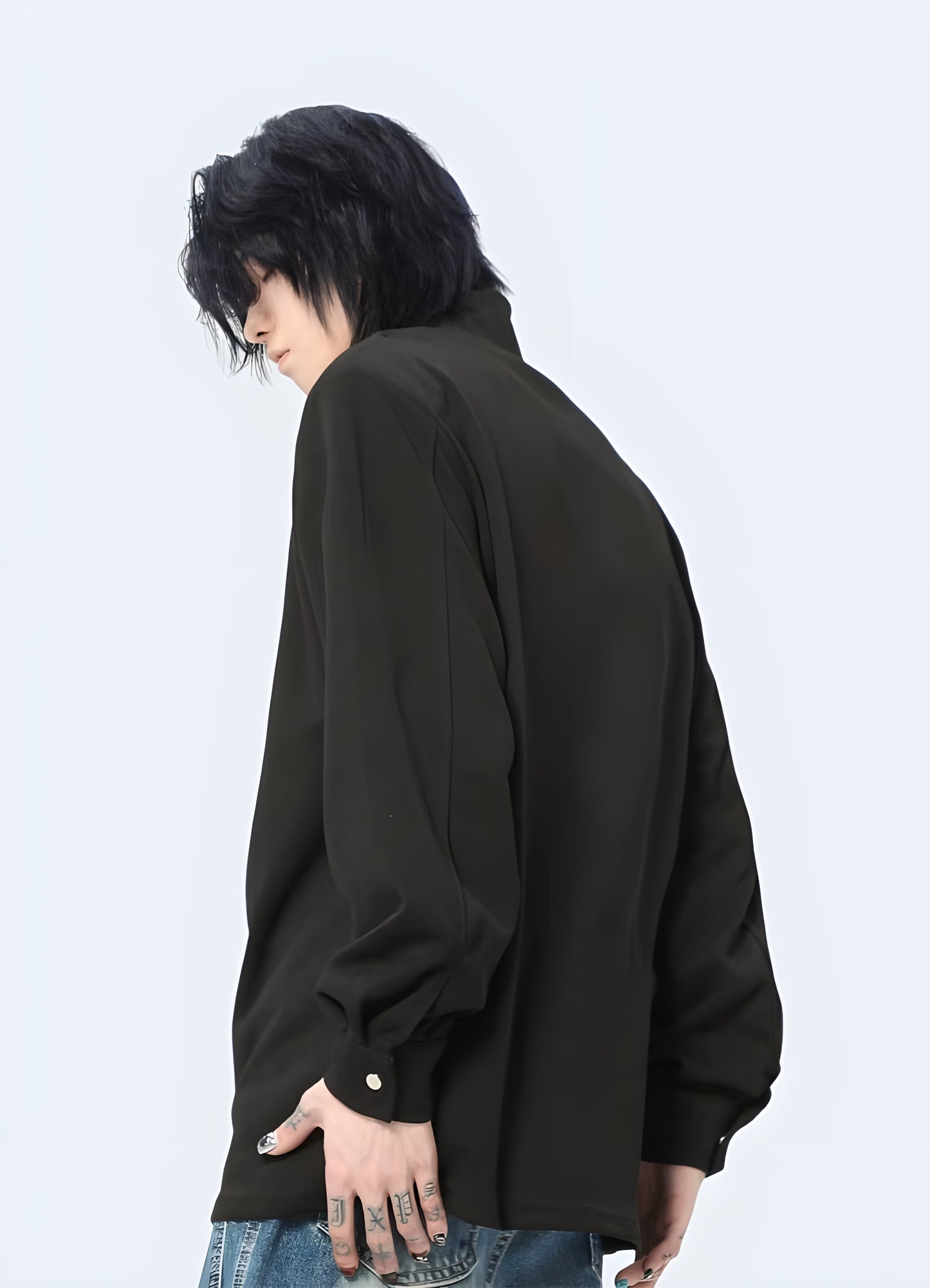 Back view of a man sporting a techwear long sleeve shirt, highlighting its advanced materials and ergonomic fit, perfect for those who demand the best in fashion and functionality in the UK.