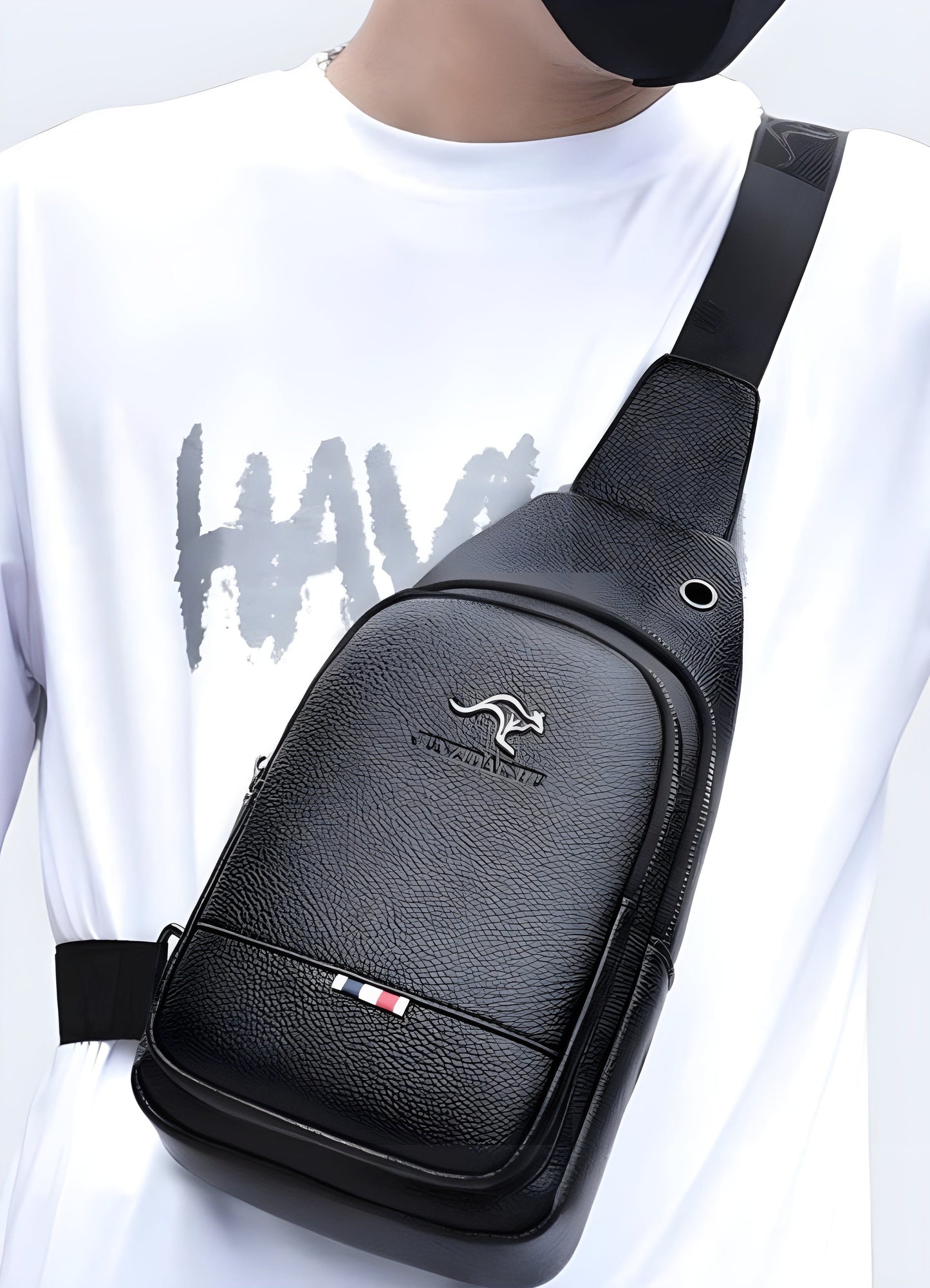 Man wearing leather chest bag, back view with model, UK. Fashionable and versatile.