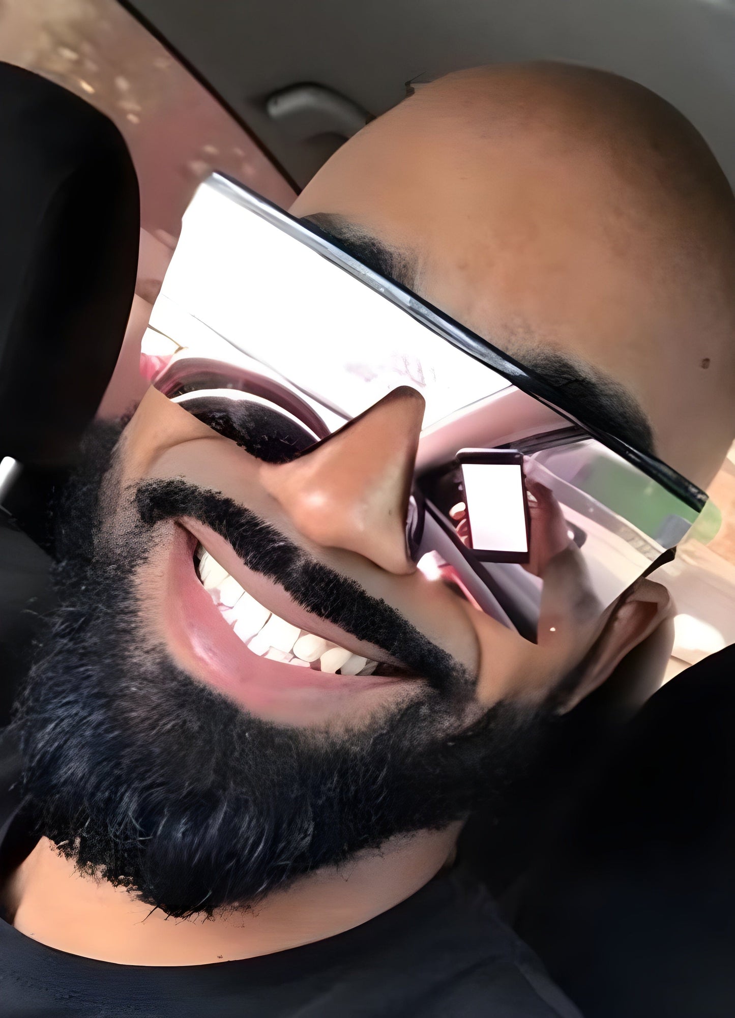 Front view of a man wearing techwear, modern outfit with futuristic design elements. The man is also wearing stylish sunglasses that complement the high-tech aesthetic of his attire.