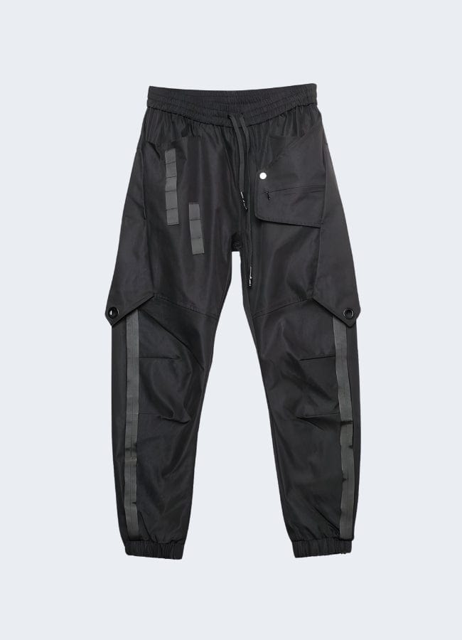 Stylish cyberpunk trousers for men featuring a sleek black base with eye-catching neon green design elements, front view, ideal for UK streetwear and alternative fashion.
