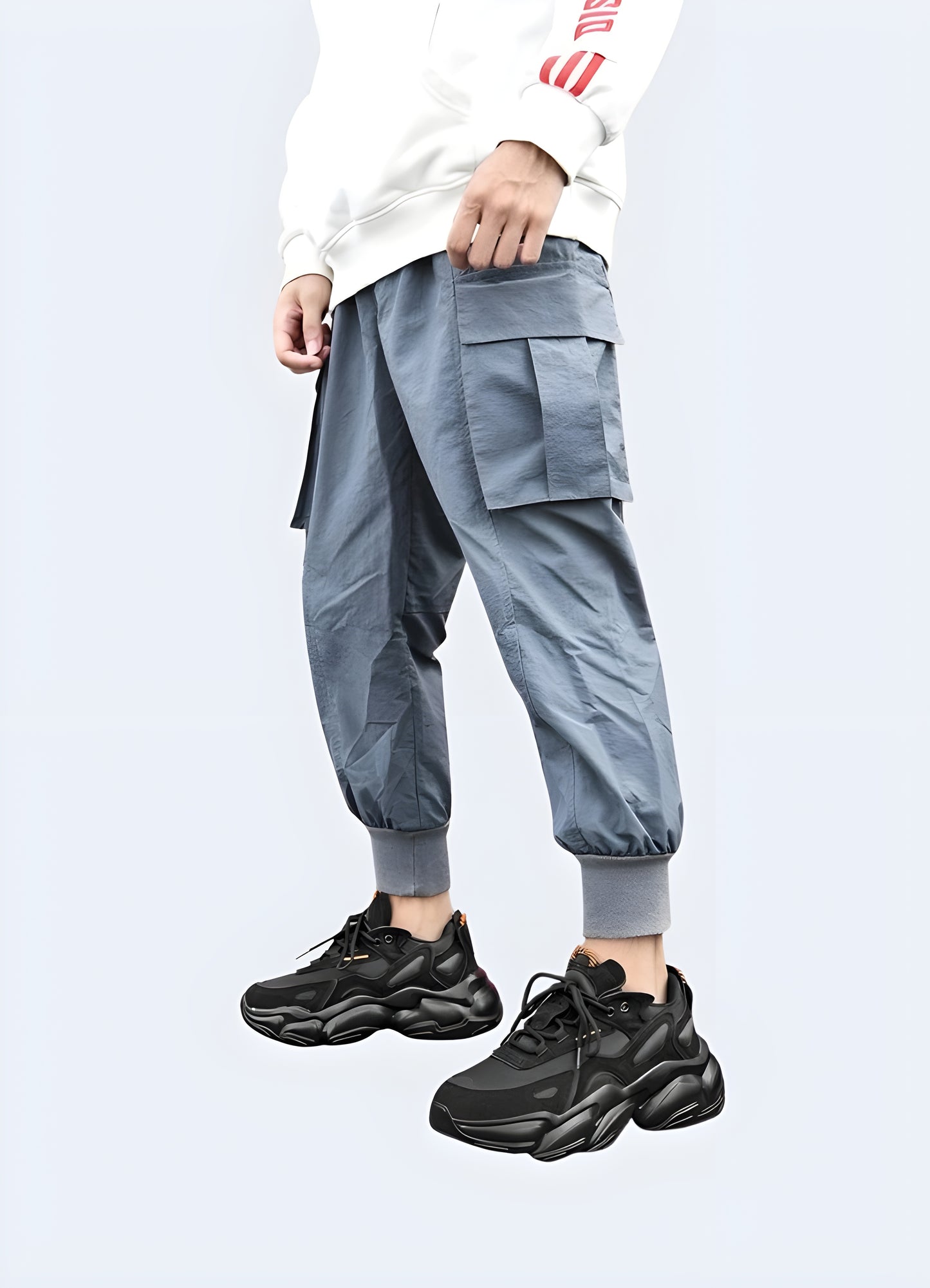 Front view of a man sporting advanced techwear sneakers, ideal for city adventures and athletic pursuits.