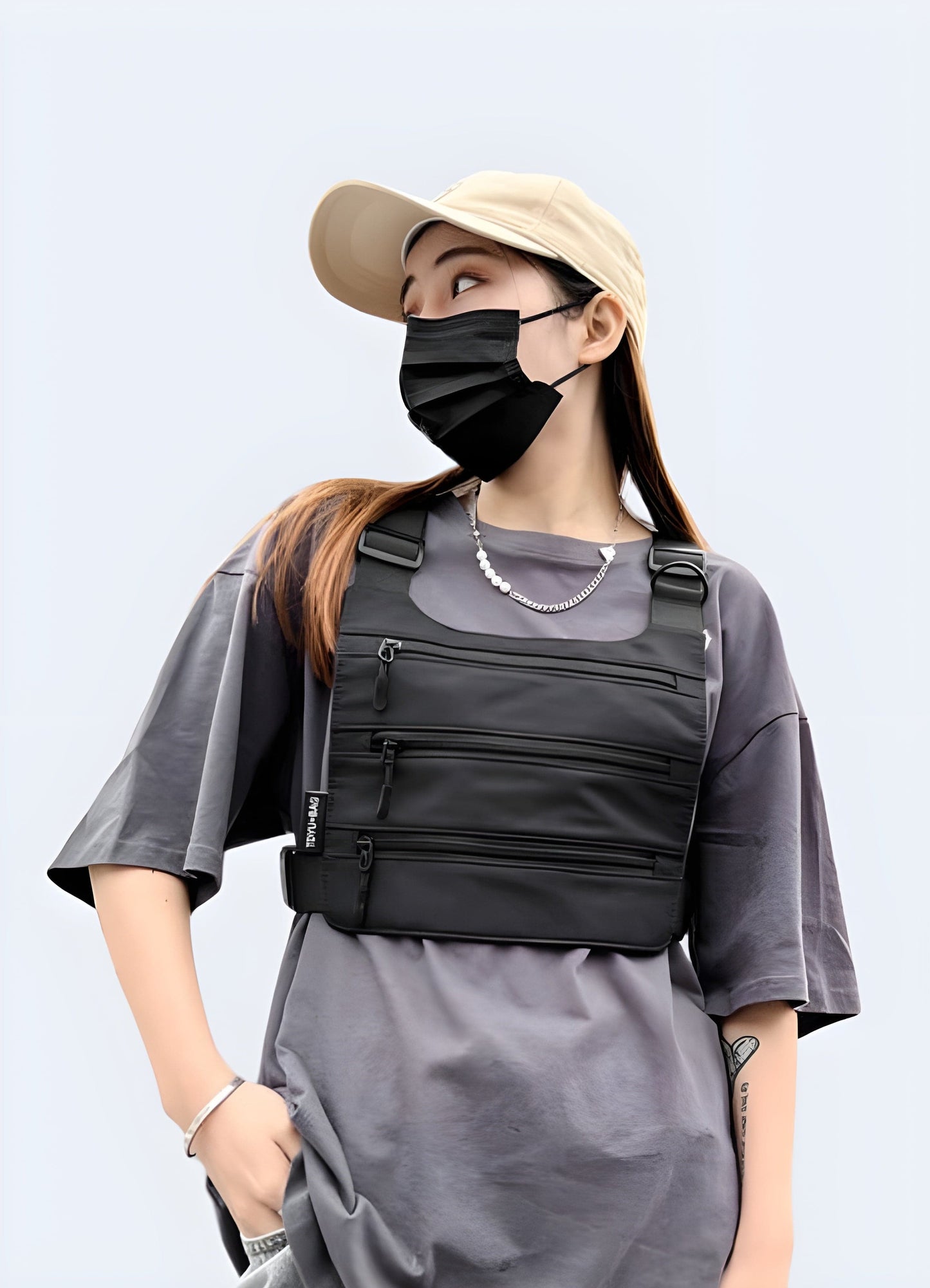 Front view of a woman wearing a tri-strap chest bag, a stylish and functional accessory in the UK.