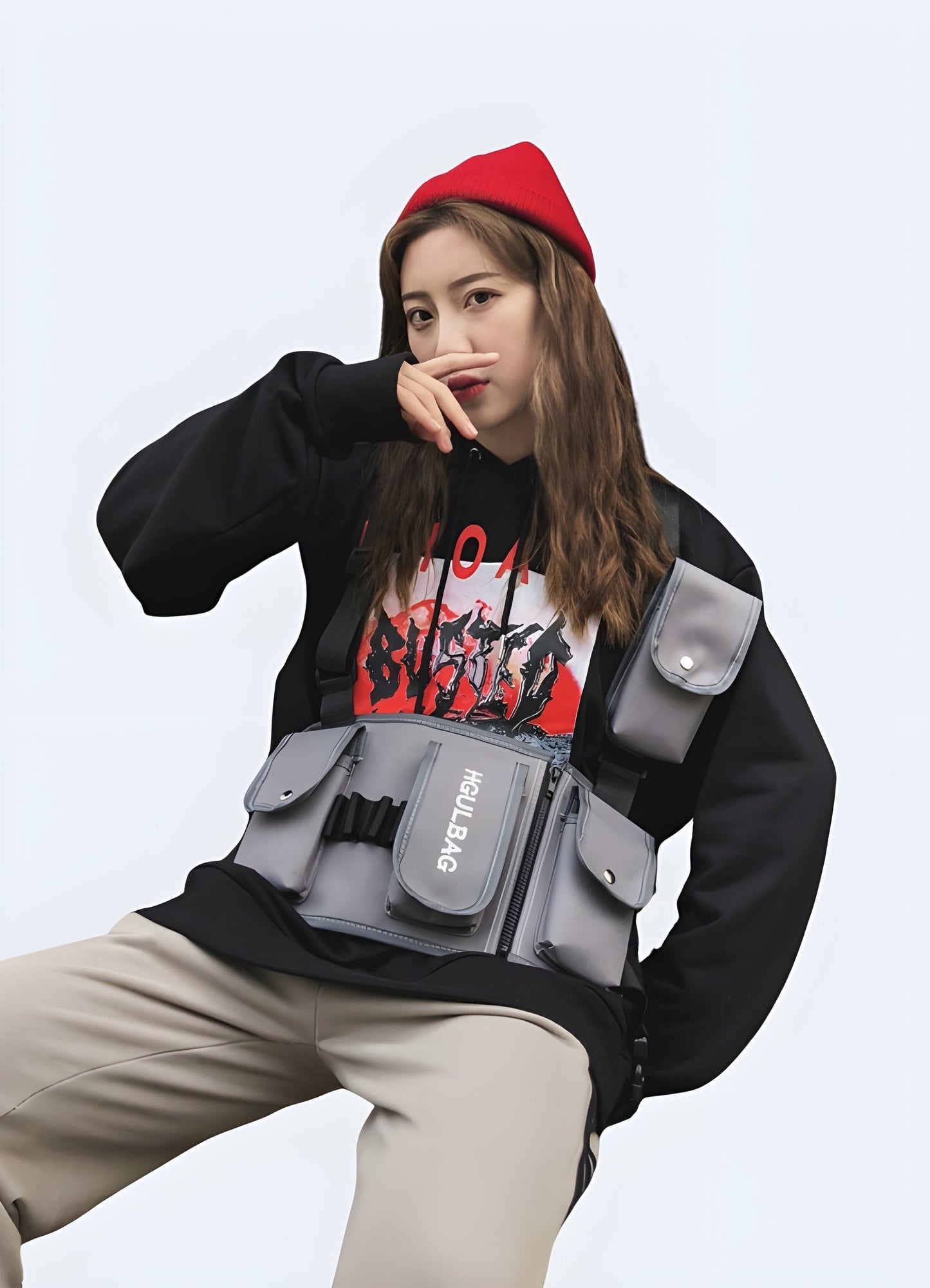 Women wearing a black utility chest bag, front and side view, combining style with functionality in the UK.