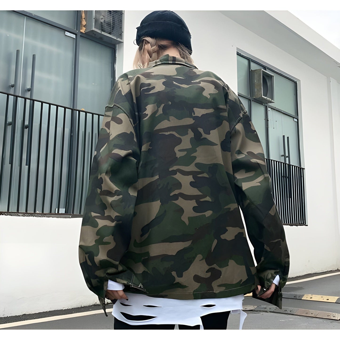 The jacket is shown in an UK urban setting with a focus on its sleek, utilitarian features and camouflage pattern.