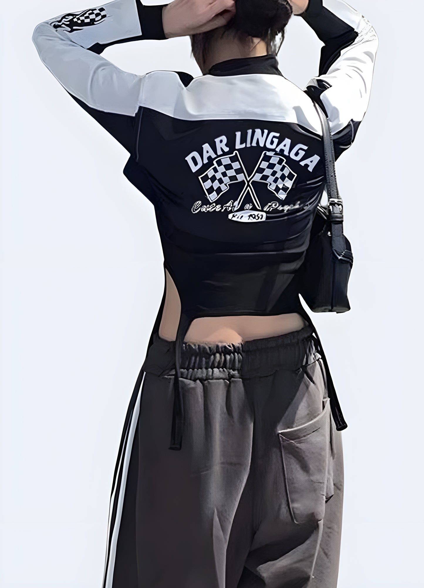 Back view of a woman sporting a motorcycle pullover crop top, highlighting its high-quality materials and attention-grabbing design for a standout fashion statement in the UK.