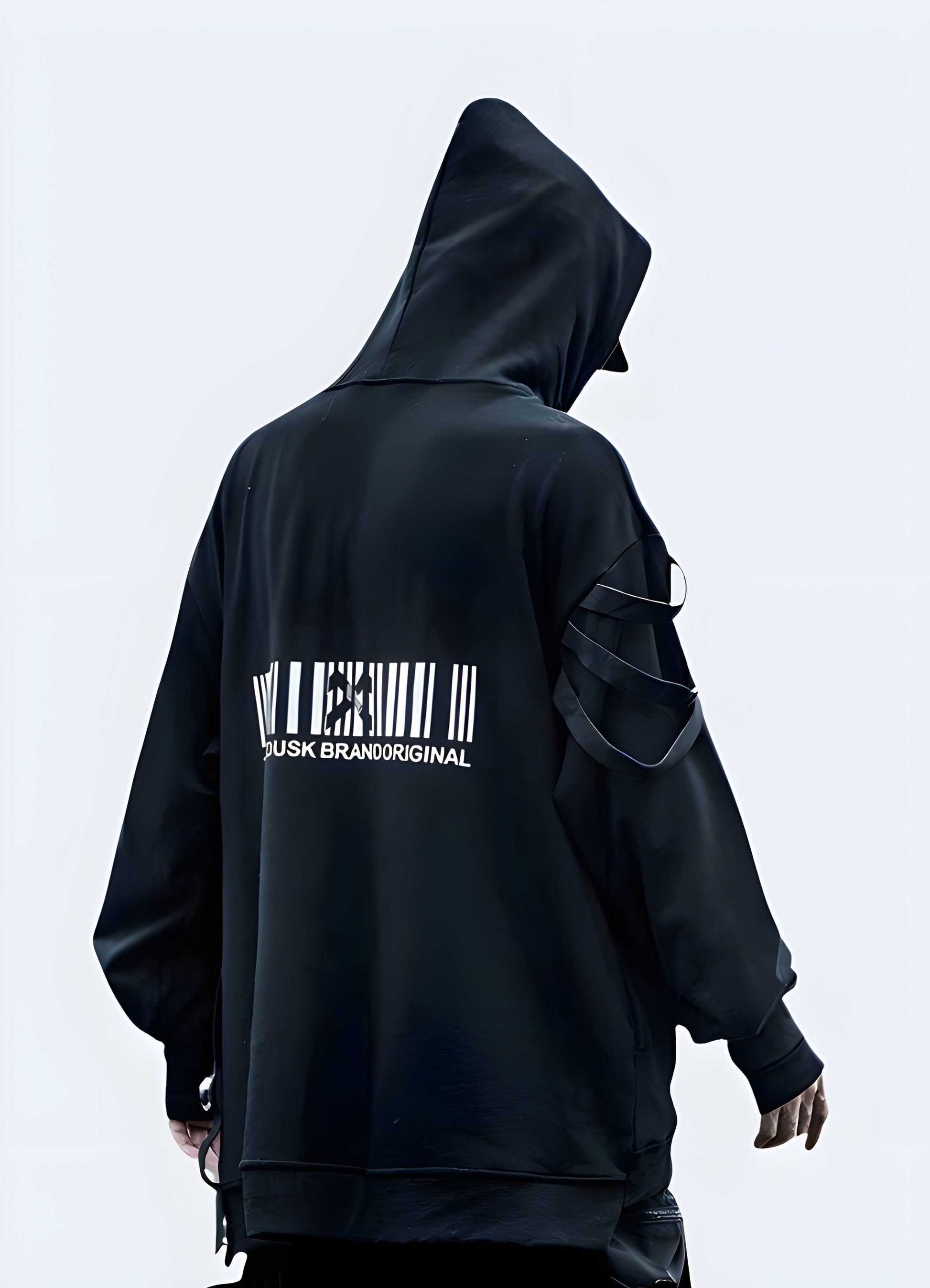 Back view of a man wearing a black techwear hoodie with a futuristic and edgy design.