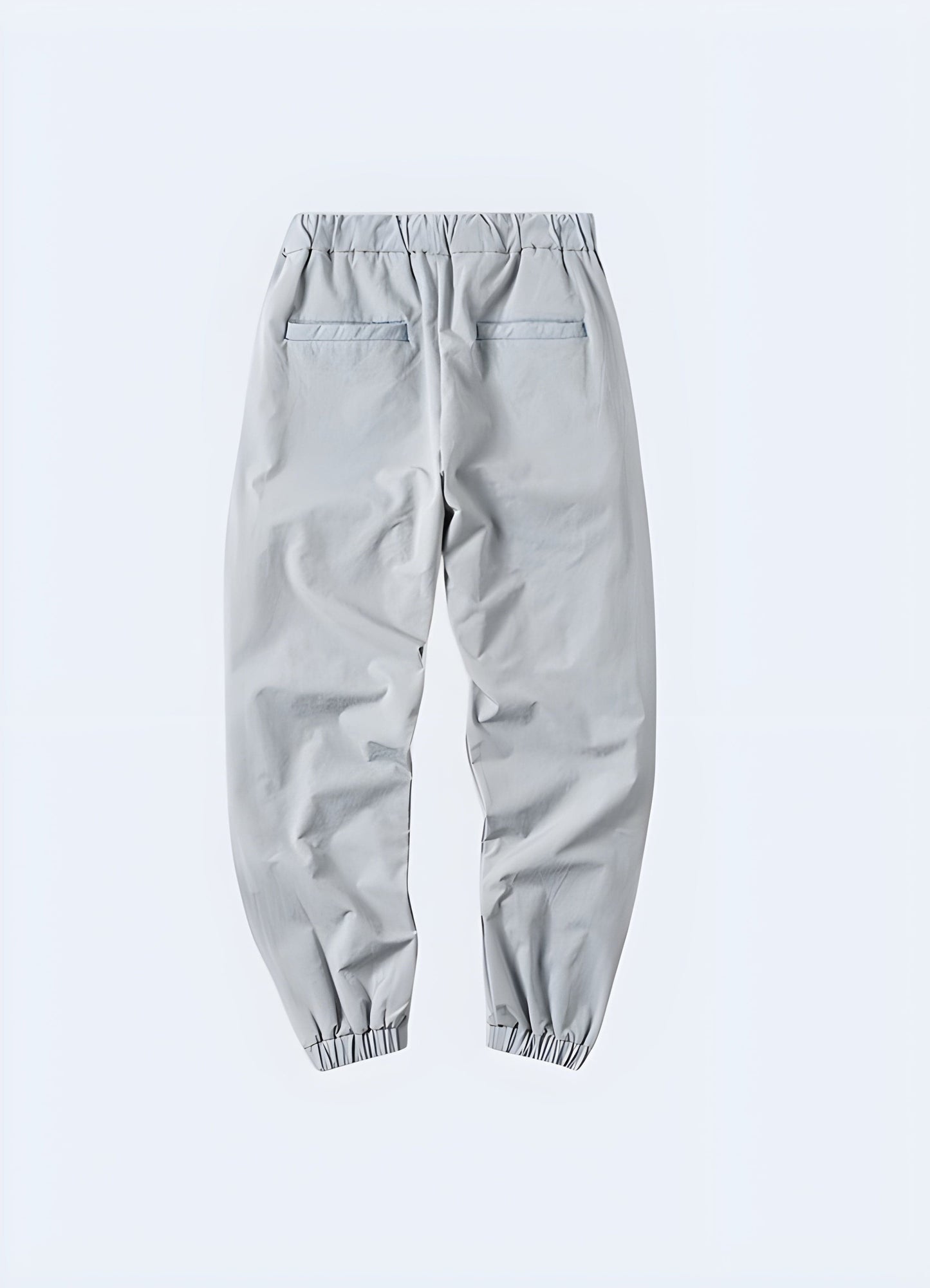 Gray avant-garde cargo pants with unique and stylish design details, showcased from the back side view, perfect for men in the UK looking to make a fashion statement.