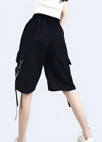 A back view of fashionable and functional baggy techwear shorts, crafted in the UK, highlighting the garment's unique design and versatile style.