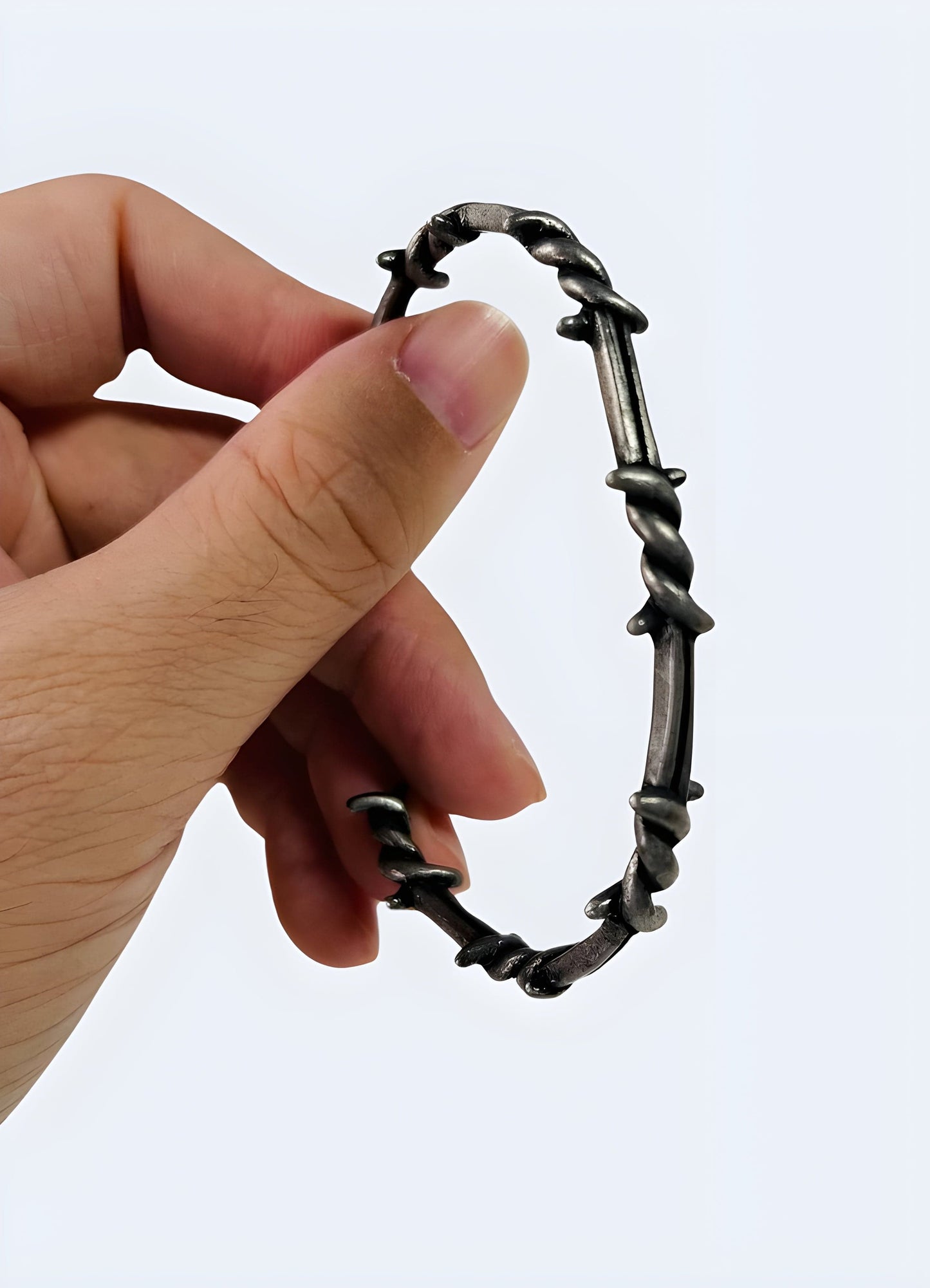 Side view of a barbed wire bangle, showcasing its unique design, available in the UK.