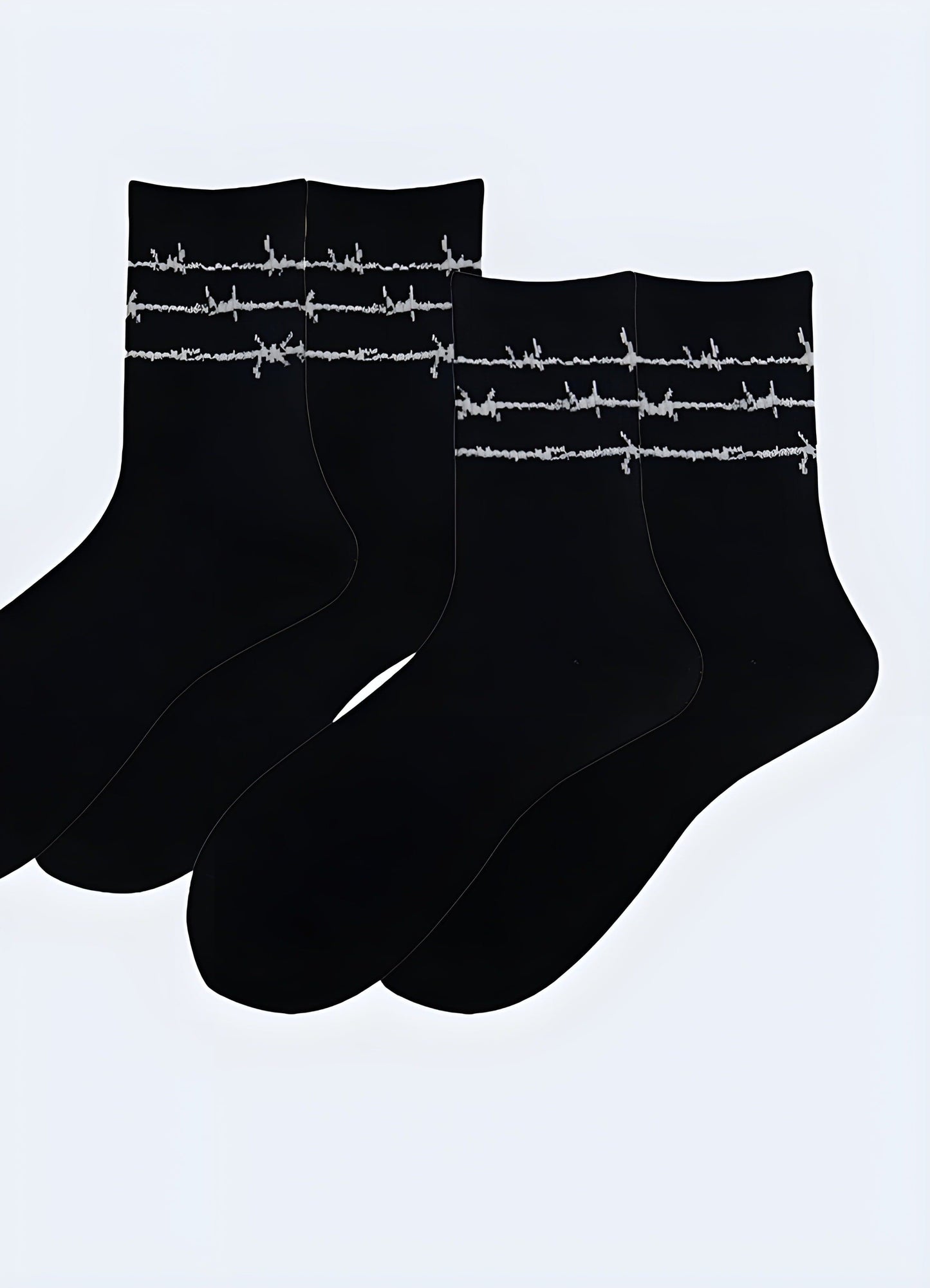 Fashionable black socks adorned with a prominent barbed wire design, perfect for adding an edgy touch to your style.