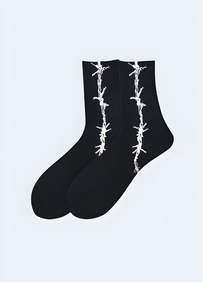 Edgy black socks with realistic barbed wire print, perfect for punk and gothic fashion enthusiasts.