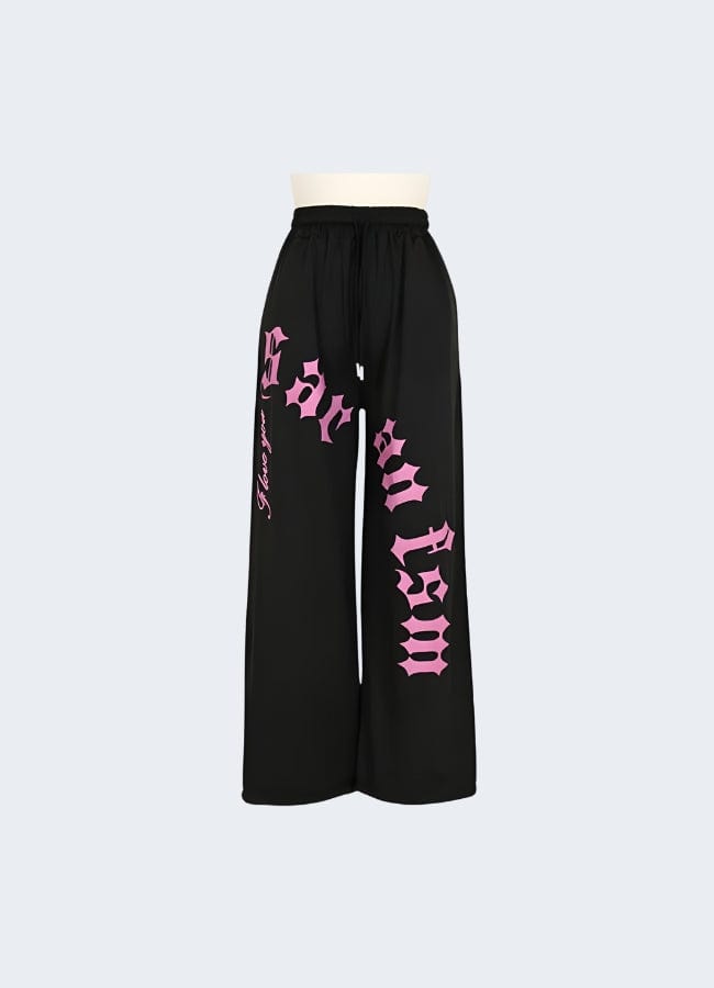 Stylish black cargo pants with contrasting pink pockets and trim, available for purchase in the UK.
