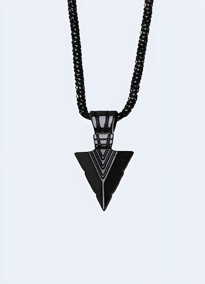 Front view of a stylish black arrowhead necklace on a model in the UK.