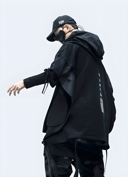 Side view of a model sporting a trendy black hoodie, representing the popular streetwear style in the UK.