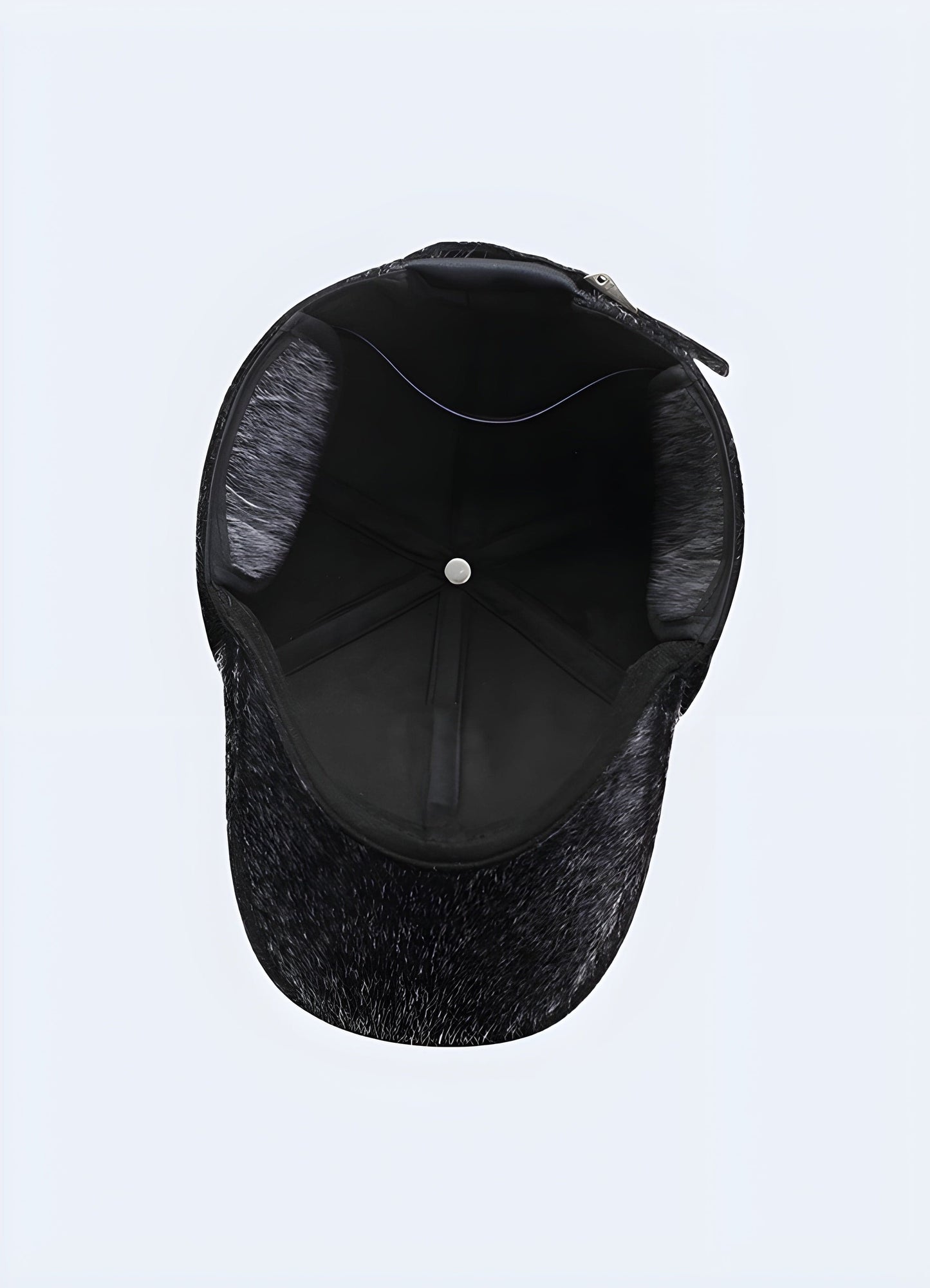 Grey back side view of black street fur cap for men, UK. Fashionable and functional fur cap for street style.