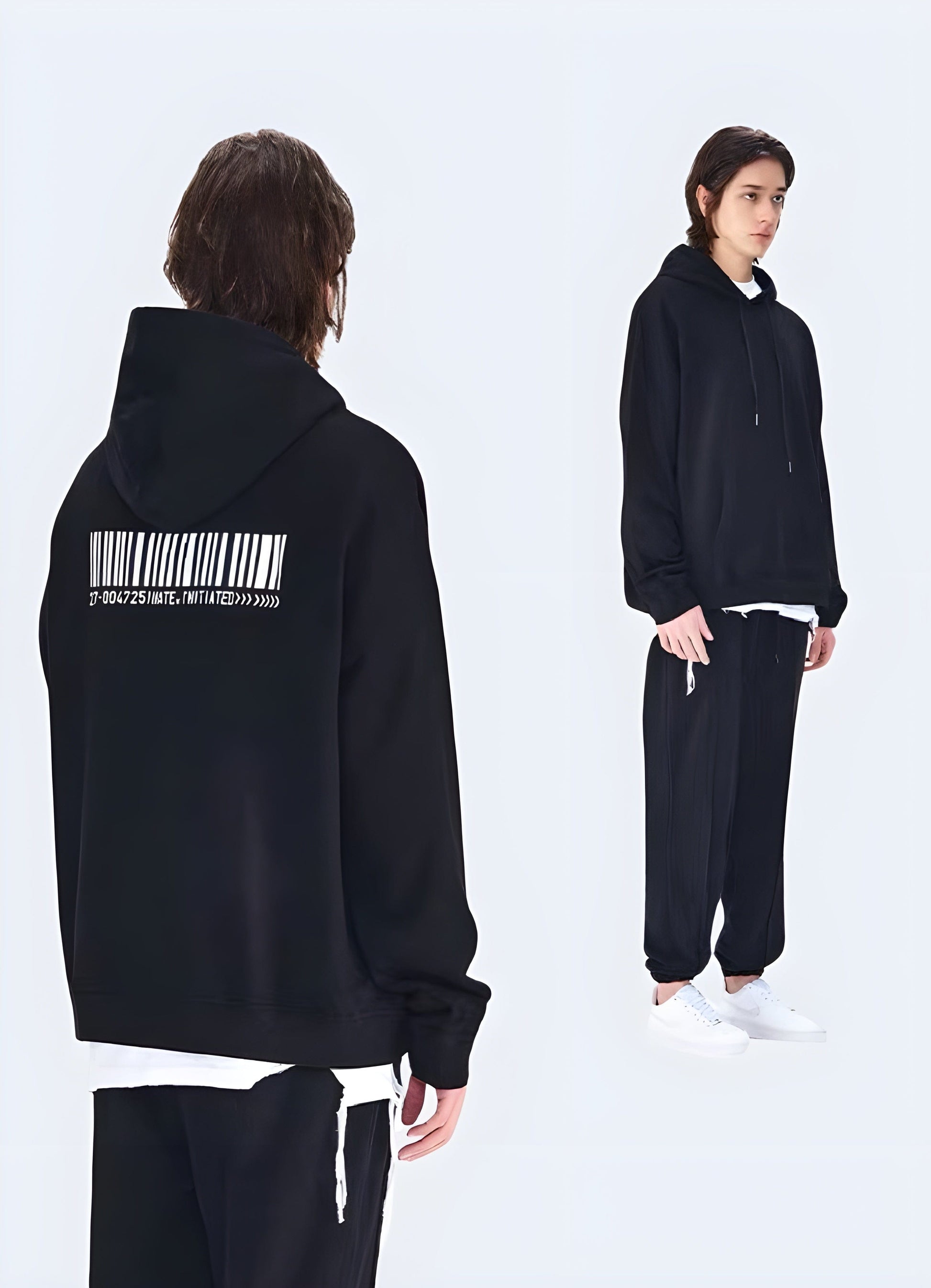 Back view of a black techwear hoodie showcasing its sleek, modern design and technical features.