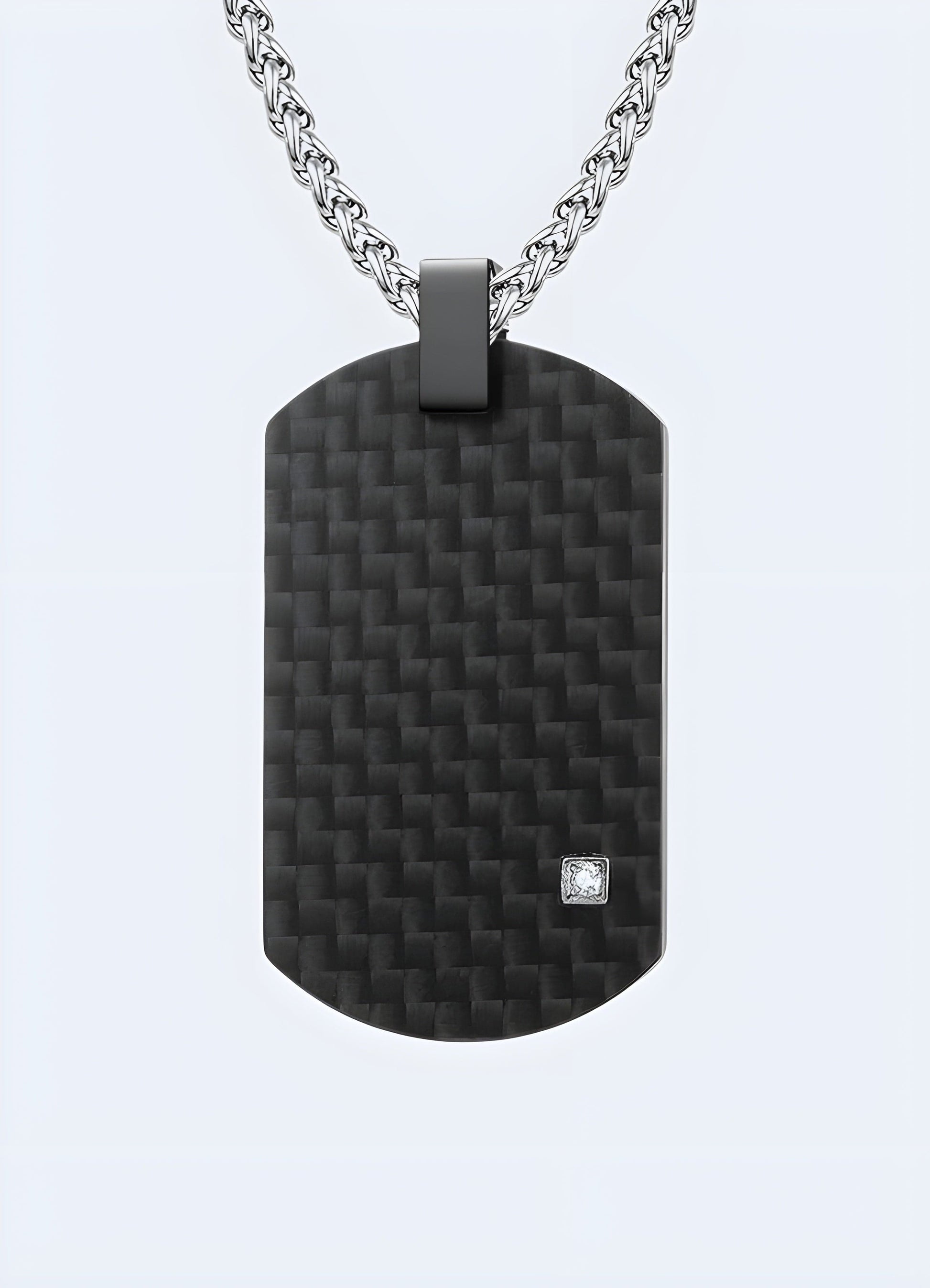 Silver carbon fiber techwear pendant from the UK, featuring a sleek and modern design for a futuristic look.