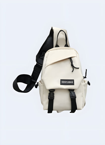 Front view of a model showcasing a white crossbody chest bag, ideal for UK fashion scenes.