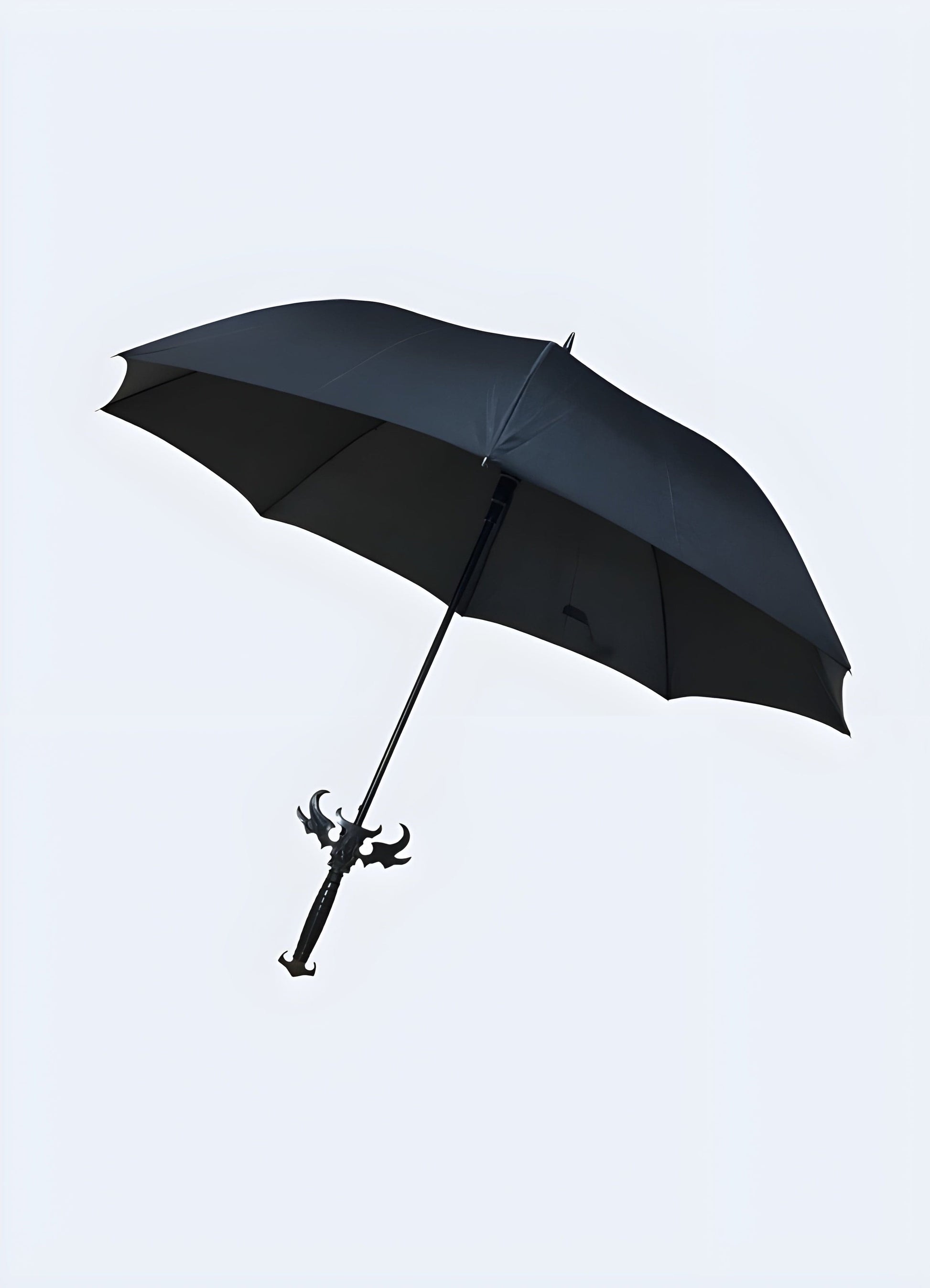 Front view of the Demon Slayer sword umbrella fully opened. The umbrella's canopy features a design that complements its sword-like appearance.