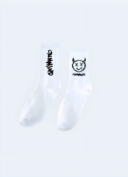 Side view of white demon socks, showcasing the detailed and sinister artwork that captures the attention of UK consumers seeking unique and bold fashion statements.