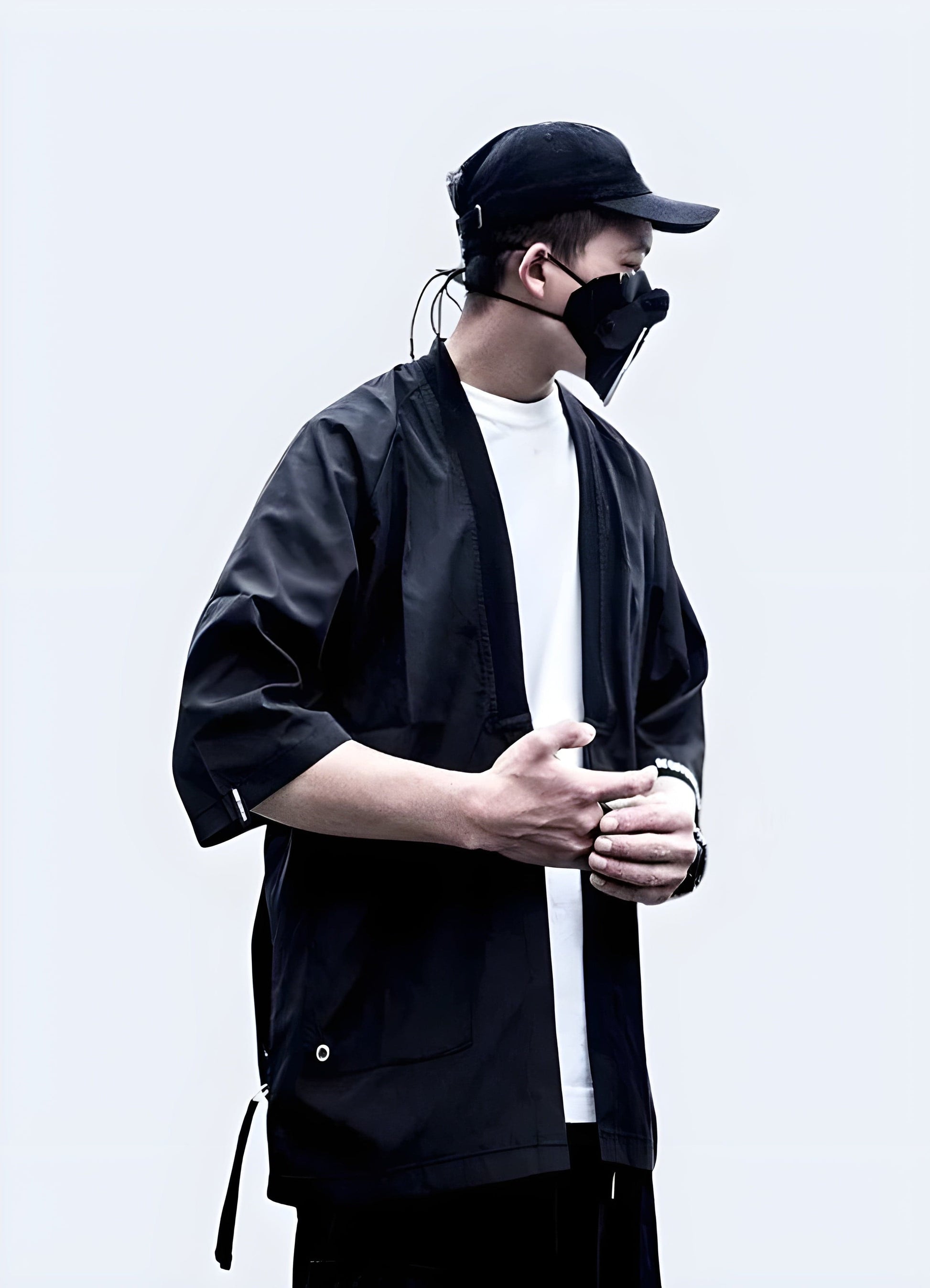 A modern twist on traditional Japanese attire, this image features a man wearing a sleek, futuristic kimono. 