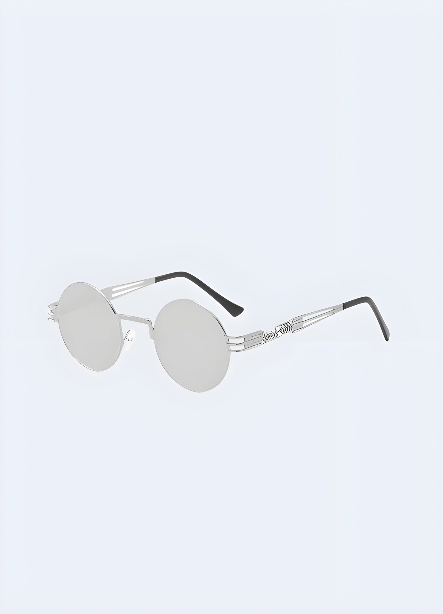 Stylish gothic sunglasses with a sleek silver frame, designed for a bold and edgy look, shown in a front side view perspective, available in the UK.