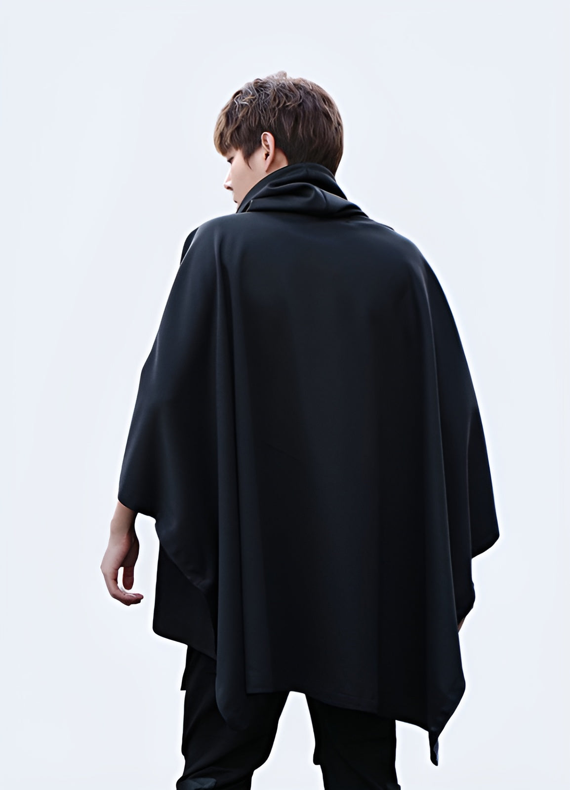 Front view of a high collar poncho, highlighting the unique collar detail and versatile style, suitable for various occasions in the UK fashion scene.