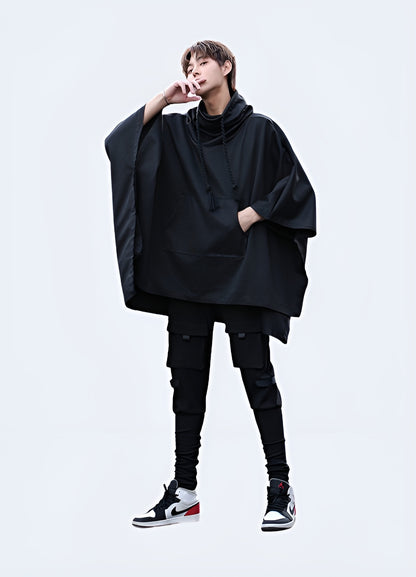 Front view of a man wearing a high collar poncho, showcasing the elegant silhouette and refined aesthetic, ideal for making a fashion statement in the UK.