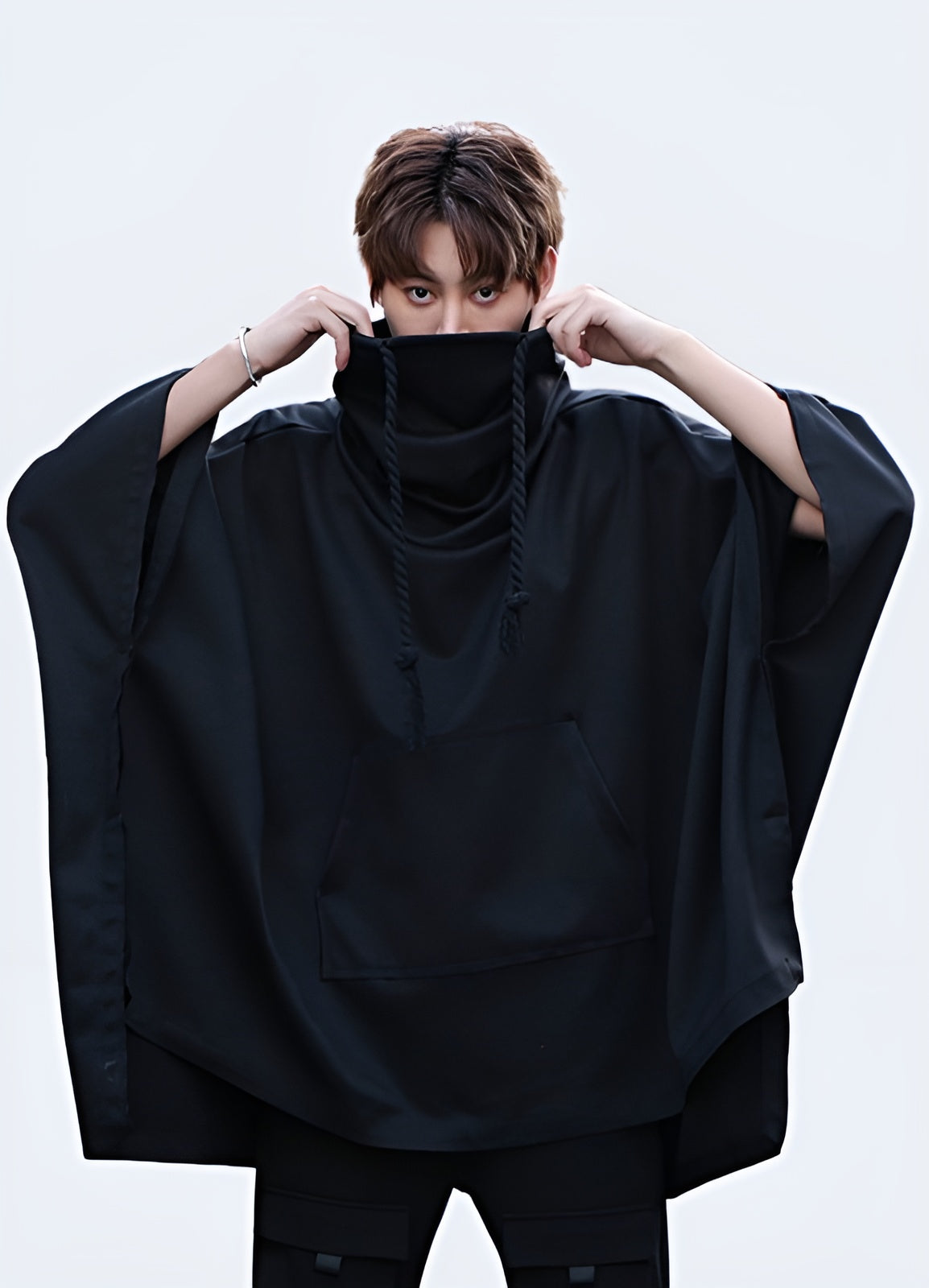 Stylish high collar poncho for man, featuring a modern and sophisticated design, perfect for the UK fashion-conscious individual.