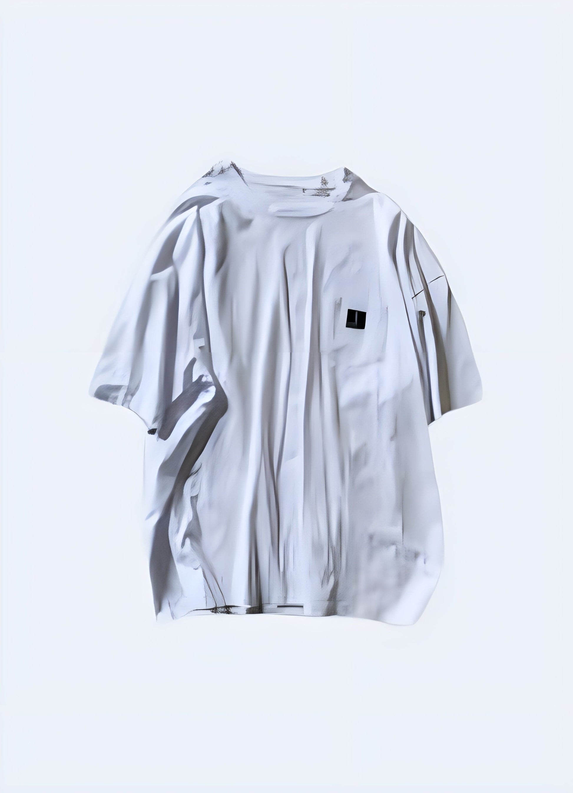 Japanese oversized shirt in white, front view, highlighting the minimalist design and loose fit for a modern streetwear look in the UK.