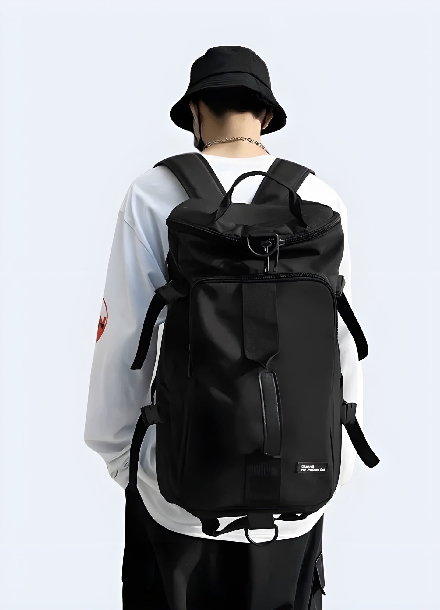 A black Japanese streetwear backpack with a stylish back view, ideal for urban fashion enthusiasts in the UK. 