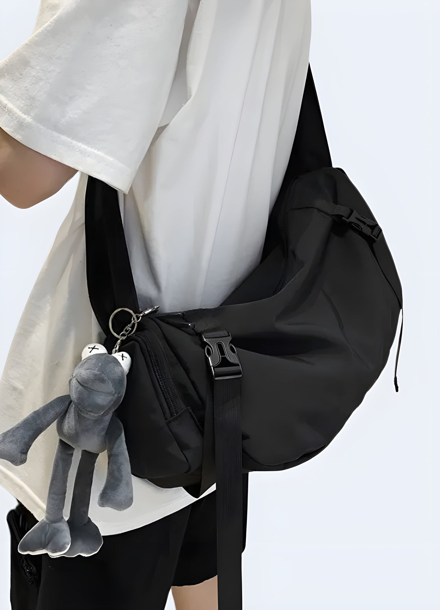 A sleek black Japanese streetwear backpack shown from the side, perfect for those seeking a modern and trendy accessory in the UK.