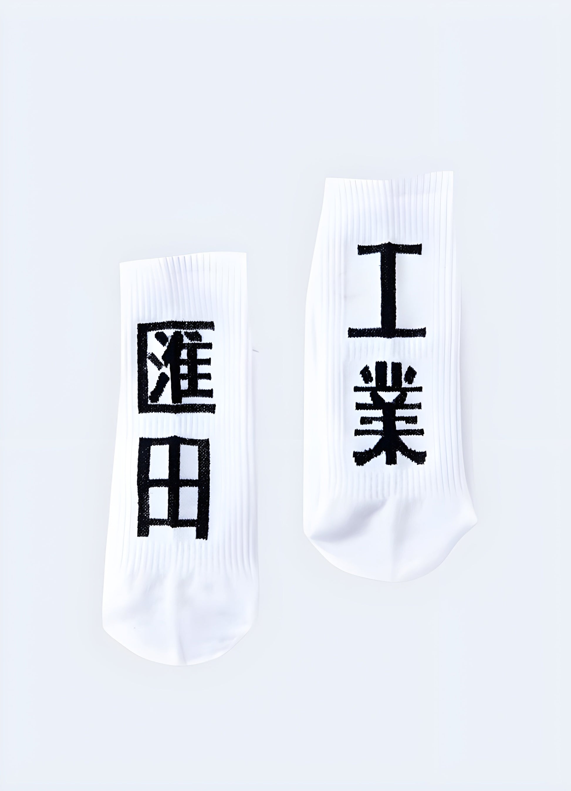 White socks with striking kanji characters, offering a stylish and distinctive look for fashion-forward individuals in the UK.