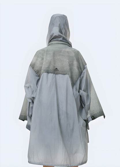 Back view of a man wearing an apocalypse poncho, showcasing the distressed details and survival-ready style, ideal for making a bold statement in the UK.