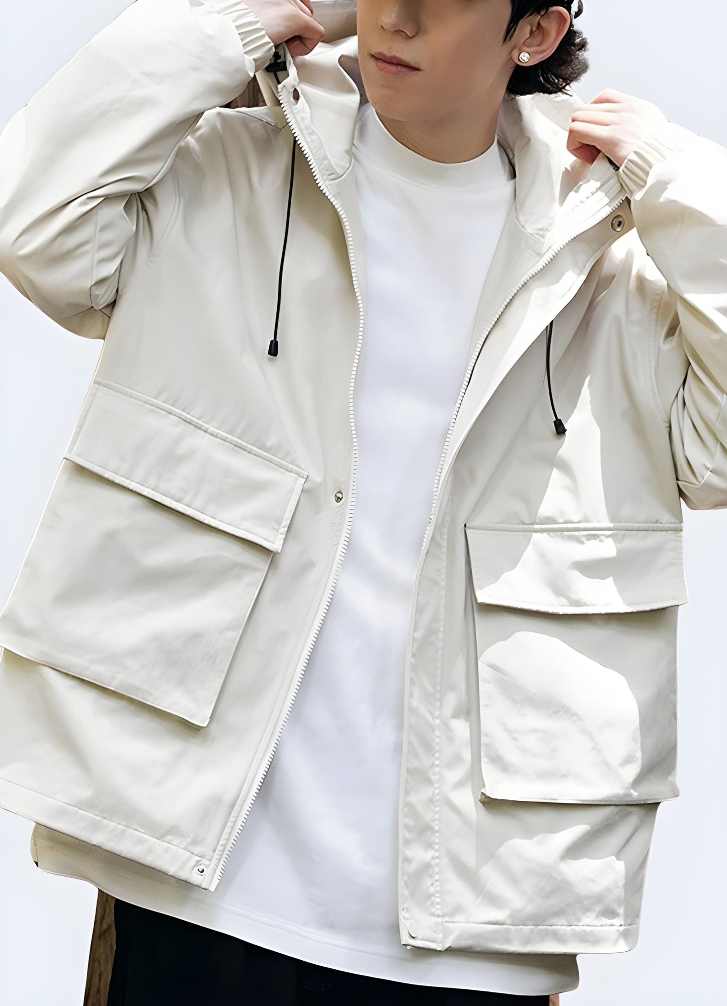 Front view of a man modeling a stylish beige cargo jacket, showcasing the versatile design with multiple pockets and a relaxed fit, perfect for casual outings or outdoor adventures.