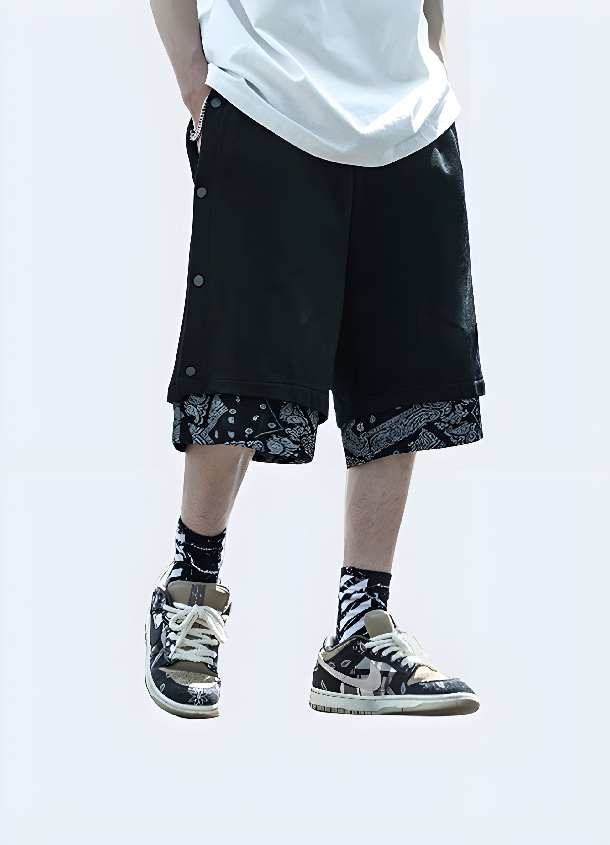 Front view of a man wearing black and white bandana shorts, showcasing the eye-catching design and stylish aesthetic, ideal for the UK fashion-forward individual.