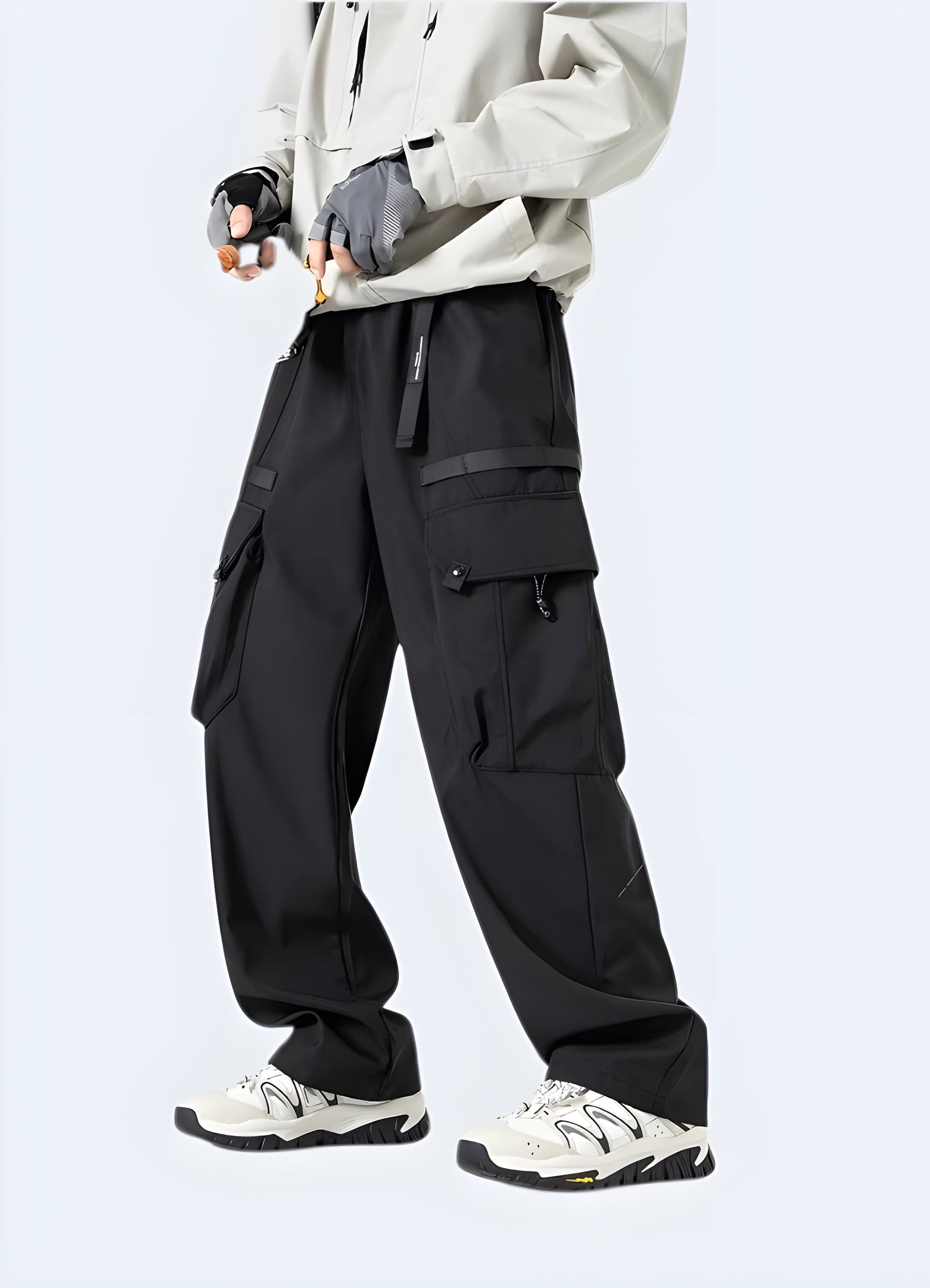 Man wearing black baggy joggers in the UK, showcasing the loose and stylish design from the right side view, ideal for those seeking comfort and trendy style.