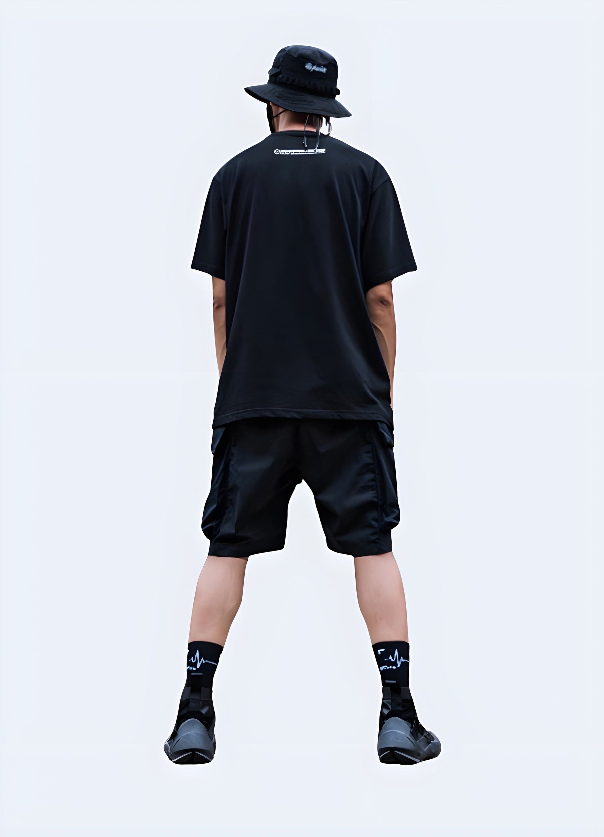 Front view of a man wearing black cargo shorts, showcasing the classic design and comfortable fit, ideal for everyday wear in the UK.