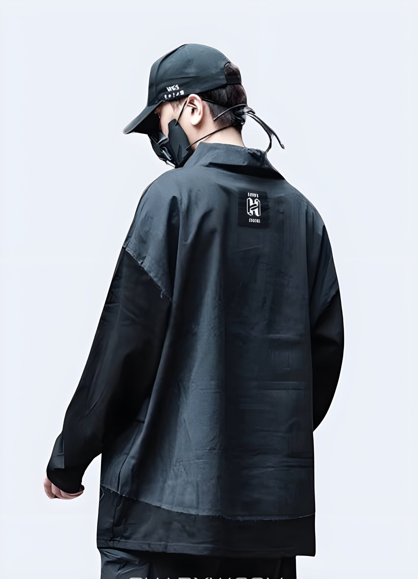 Back view of a man wearing a stylish black Japanese hoodie, ideal for UK streetwear enthusiasts.