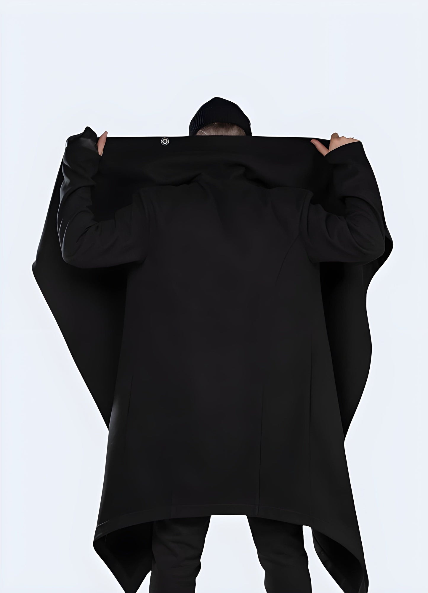 Back view of a man wearing a black cyberpunk cloak, showcasing its edgy and dystopian-inspired style for a bold fashion statement in the UK.