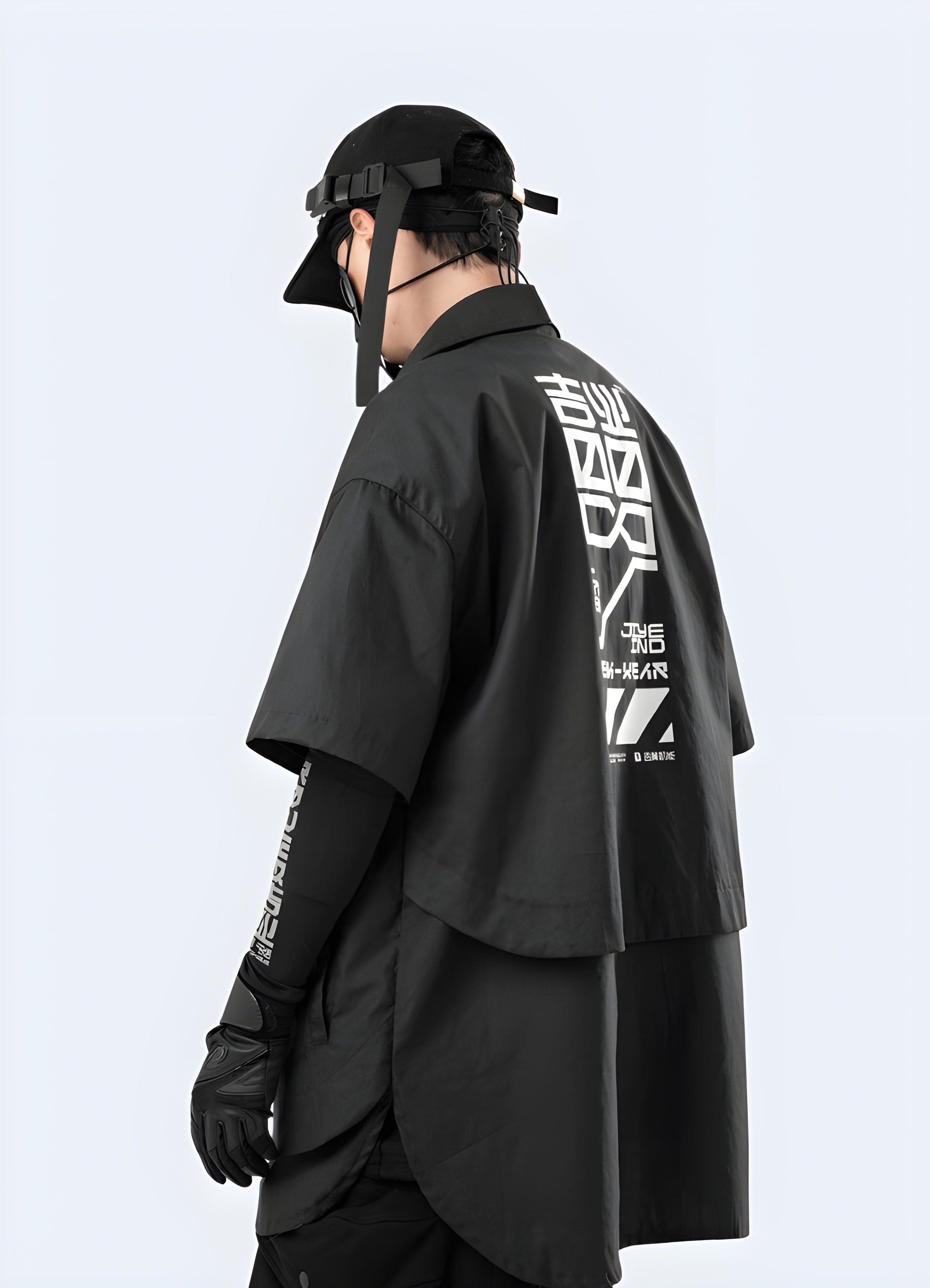 Back side view of a man donning an avant-garde cyberpunk kimono in black and red, photographed in the UK.