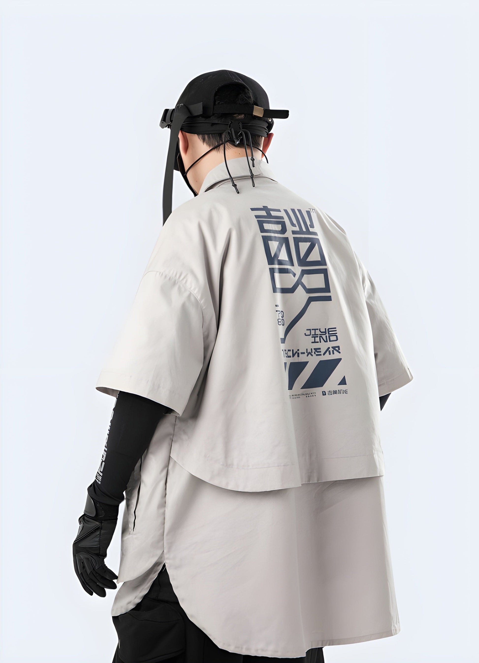  Side and back view of a man sporting a cutting-edge cyberpunk kimono with black and red accents, photographed in the UK setting.