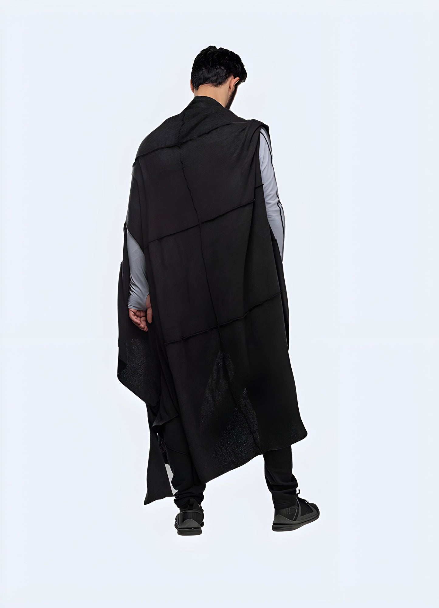 Back view of a man wearing a cyberpunk poncho, showcasing the unique silhouette and attention to detail, ideal for making a bold statement in the UK.